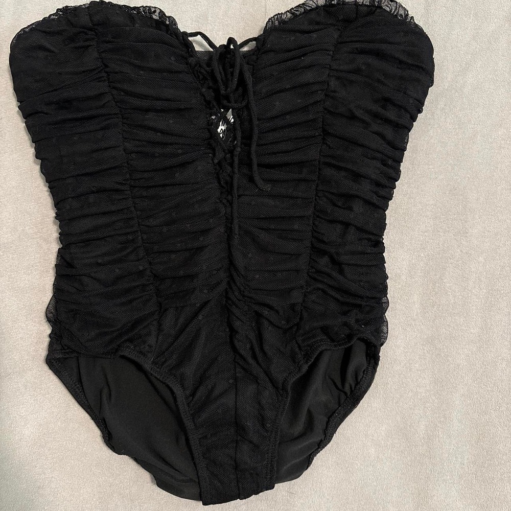 Princess Polly bodysuit with ruching and dots all over.